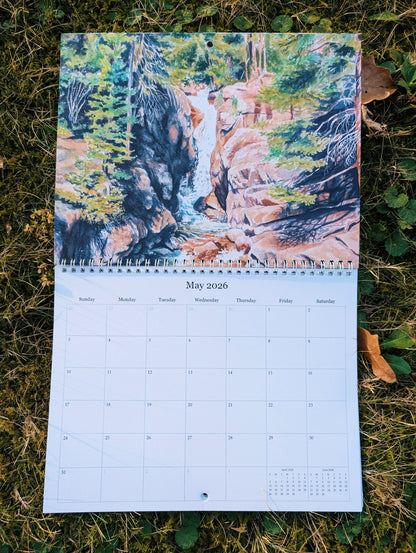 Calendar with a nature-themed cover showing a waterfall