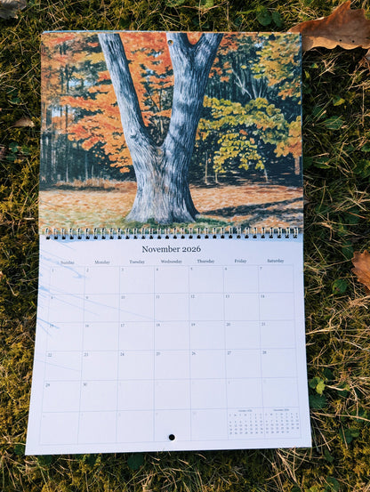 Calendar with a scenic autumn design on grass