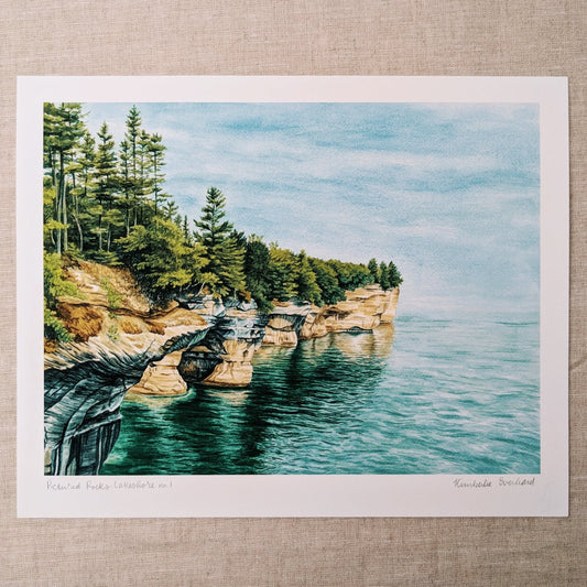 Pictured rocks national lakeshore with pine trees and bright blue water